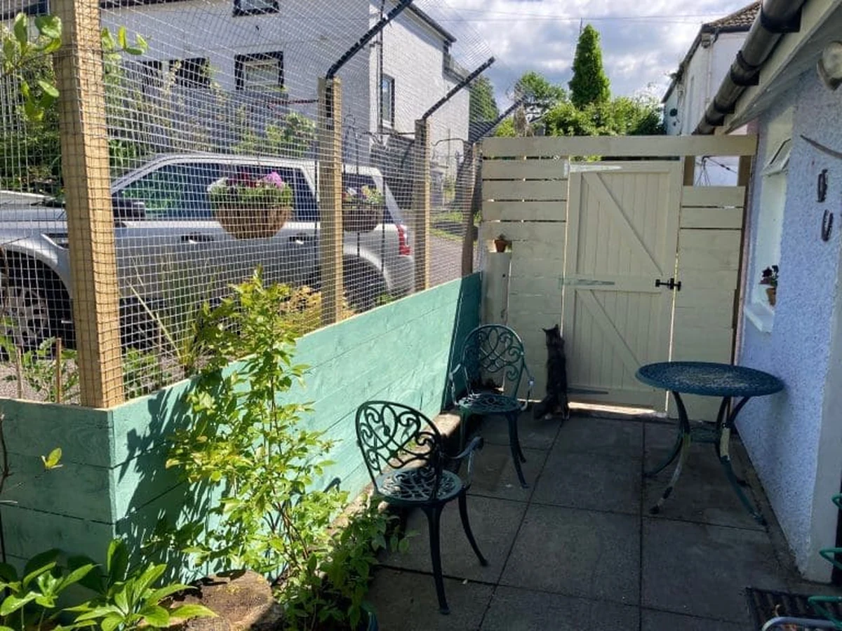 Small garden patio with shed painting Windsor Decorators