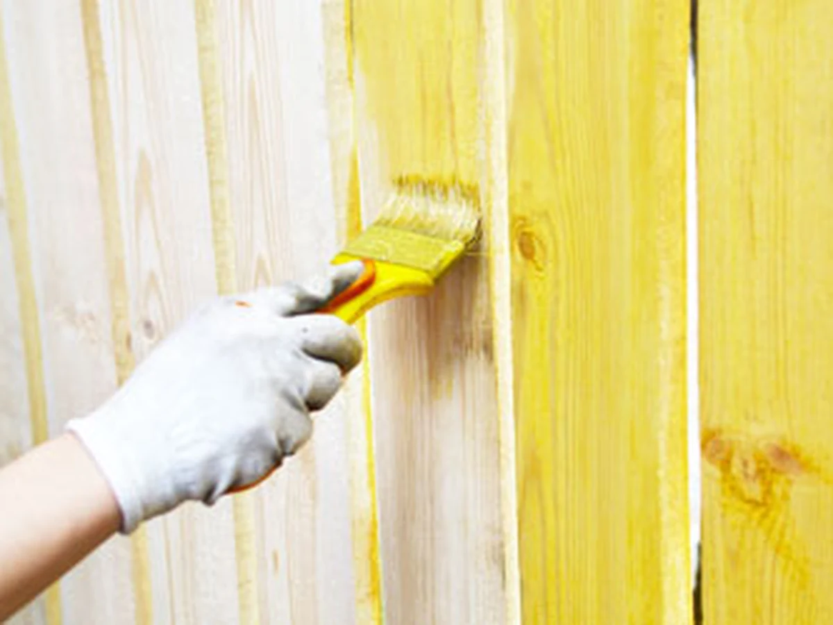 fence-painting-gloved-hand-applying-windsor-decorators Fence painting and staining in Windsor by professional decorators