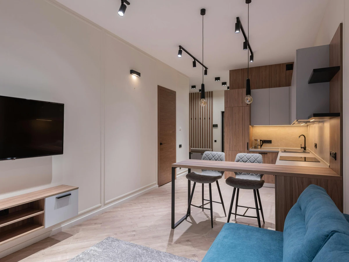 Open plan lounge painting in Farnham Royal home by Windsor Decorators