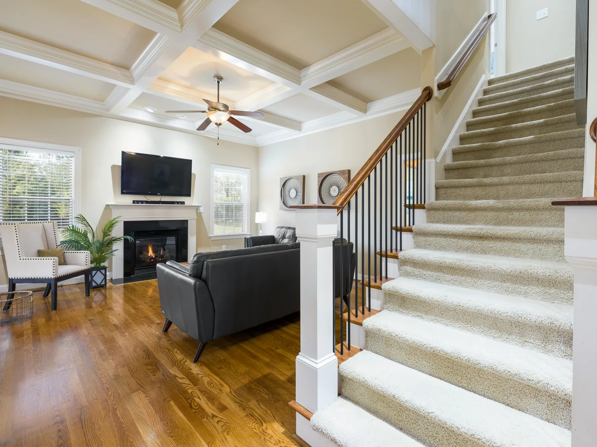 Carpeted staircase hallway painting in Windsor by Windsor Decorators