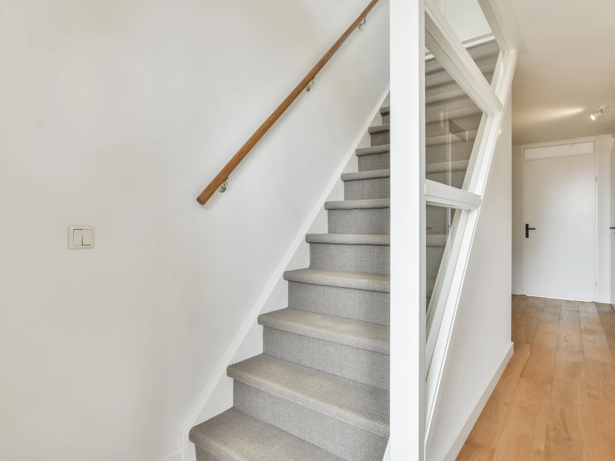 Clean white staircase painting Windsor Decorators