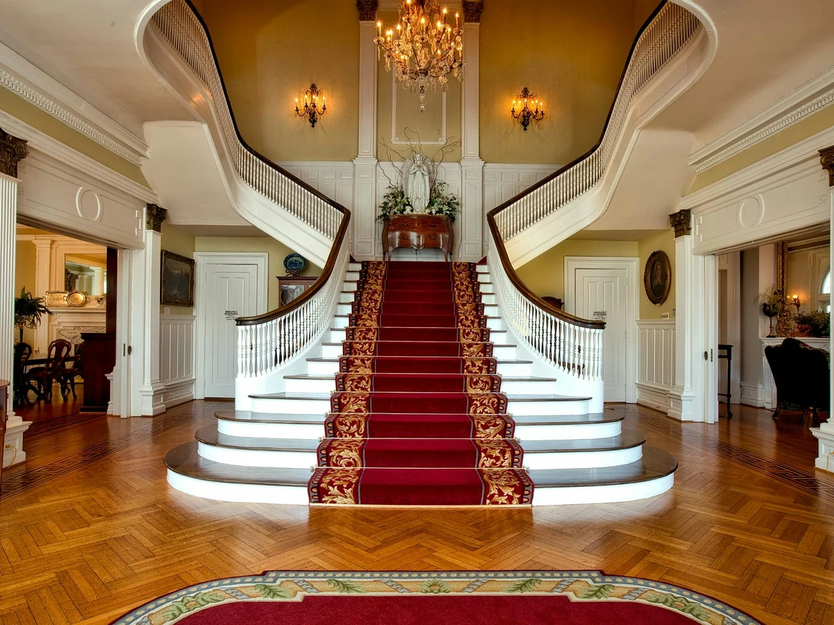 Grand sweeping staircase painting Sunninghill executive home Windsor Decorators