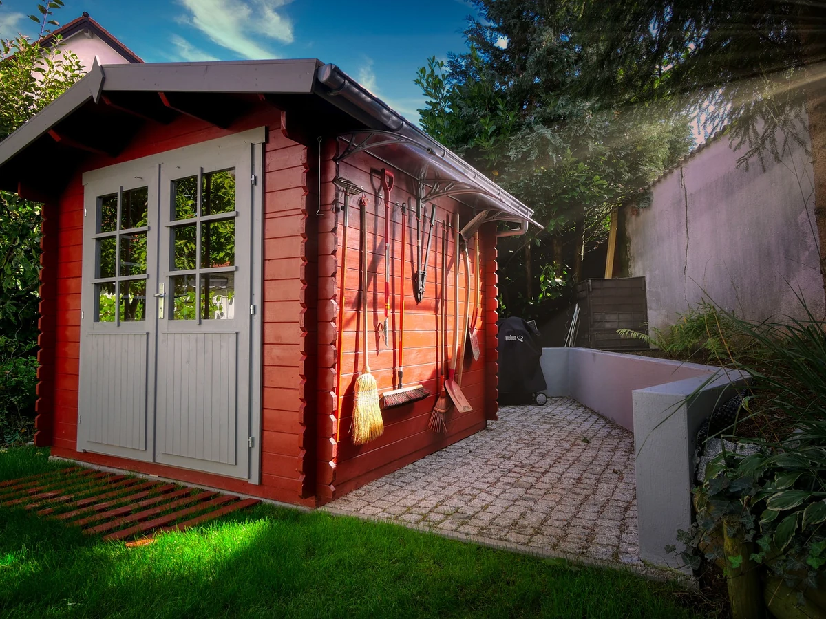 Red garden shed exterior timber painting by Windsor Decorators